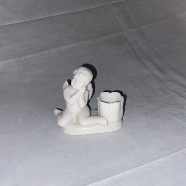 Statuetta angioletto con porta candela in ceramica