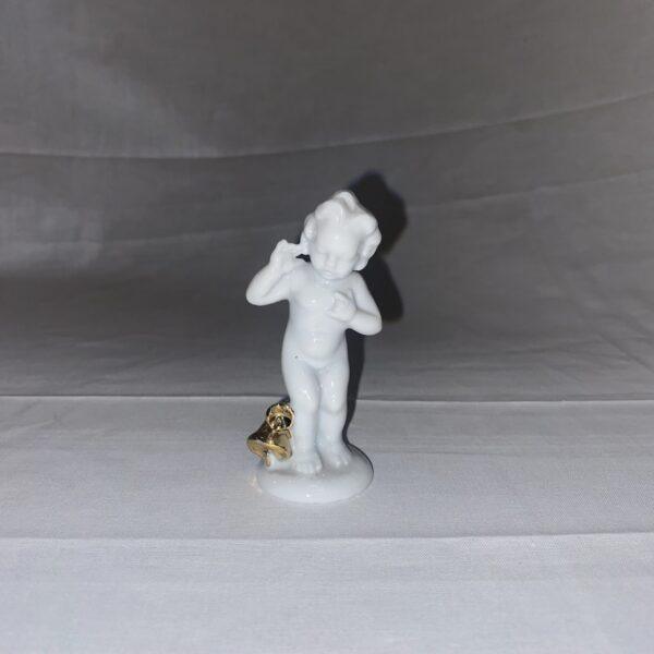 Statuetta bambino con campane dorate in ceramica